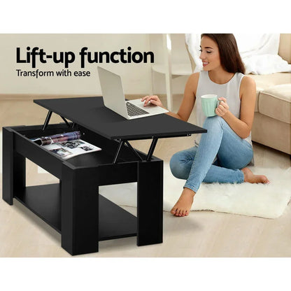 Black lift-up coffee table with storage, woman using laptop in modern living room