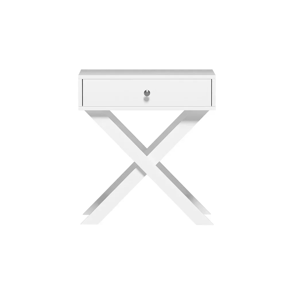 Modern white bedside table with single drawer and X-shaped legs on a white background
