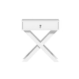 Modern white bedside table with single drawer and X-shaped legs on a white background