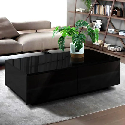 Modern black coffee table with glossy finish and potted plant in a stylish living room