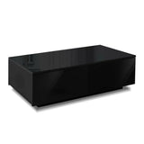 Modern black rectangular coffee table with glossy finish and storage drawers on white background