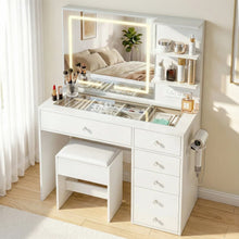White makeup vanity table with LED mirror, storage drawers, stool, and organized cosmetics