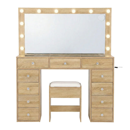 Wooden makeup vanity set with lighted mirror, cushioned stool, and multiple drawers