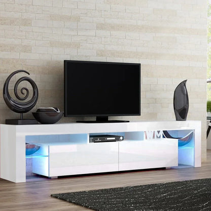 Modern white TV unit with LED lighting, flat screen TV, and decorative accents in living room