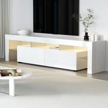 Modern white TV cabinet with glossy finish, storage shelves, and minimalist decor in living room