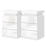 Set of two modern white high gloss LED bedside tables with three drawers
