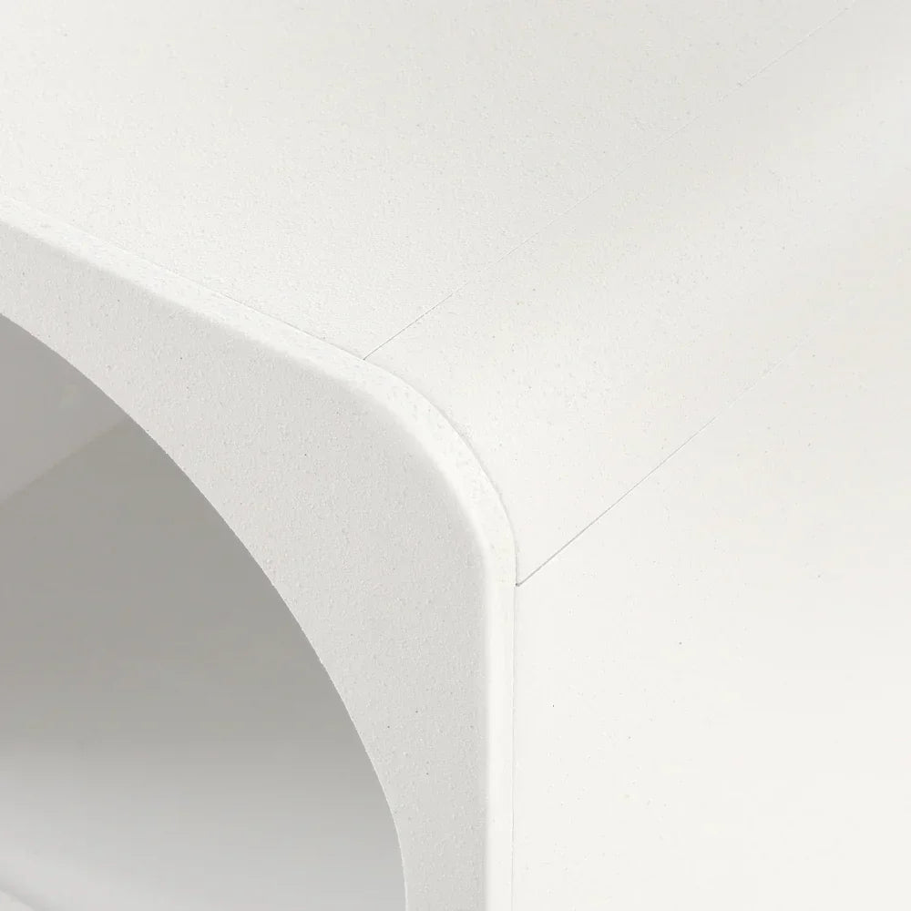 Close-up of modern white minimalist furniture with smooth rounded corner detail