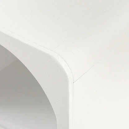 Close-up of modern white minimalist furniture with smooth rounded corner detail