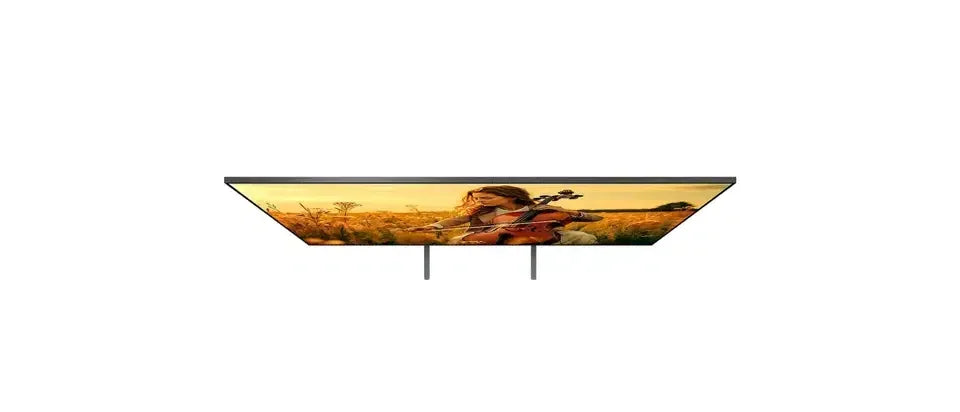 Ultra-thin smart TV on stand displaying woman playing violin in field, Stacks Warehouse online deal
