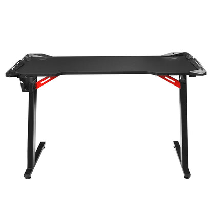 Black gaming desk with red accents, ergonomic design for computer setup