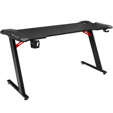 Black gaming desk with red accents, cup holder, and Z-frame legs for PC setup