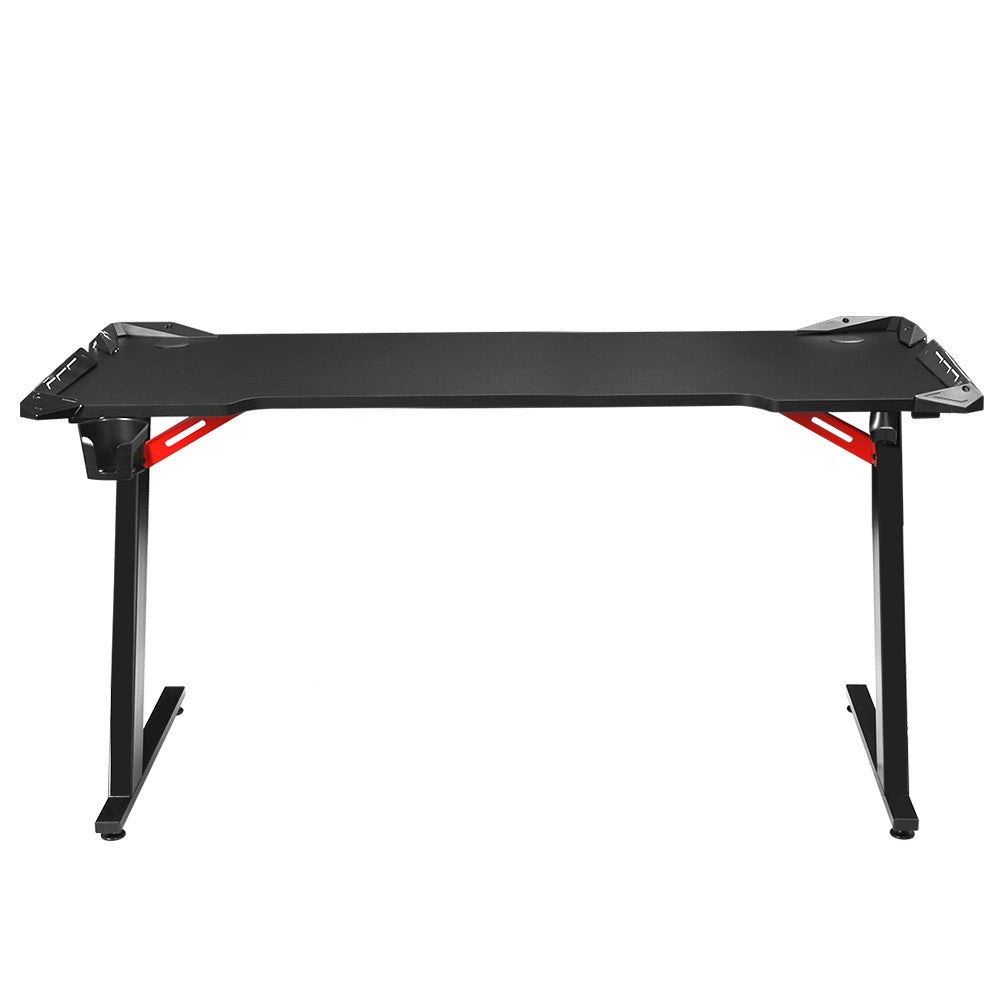 Black gaming desk with red accents, ergonomic design for computer setup