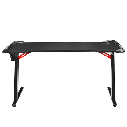 Black gaming desk with red accents, ergonomic design for computer setup