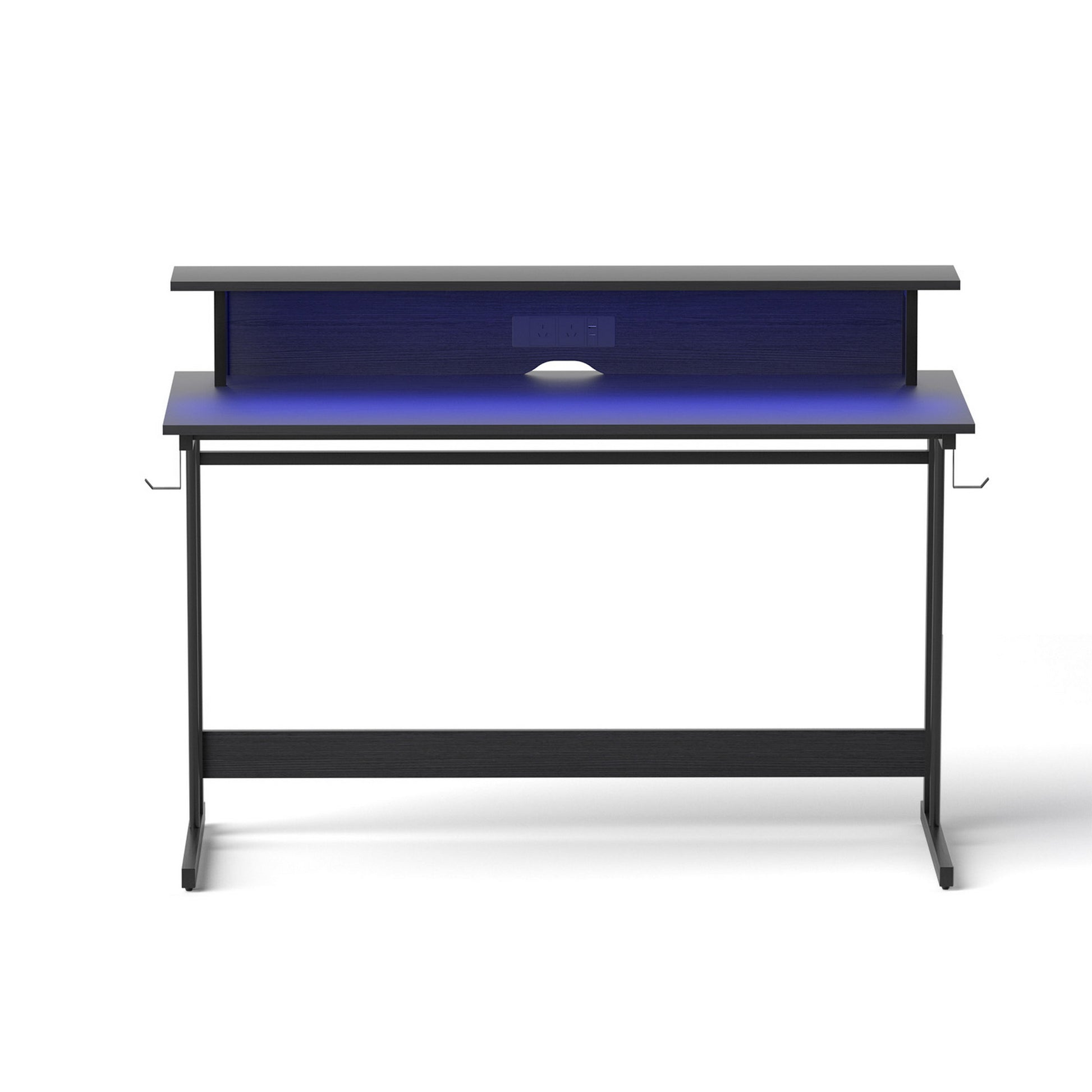 Modern black desk with blue LED backlight and built-in power outlets for home office setup
