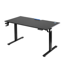 Black adjustable standing desk with blue cable clips and control panel