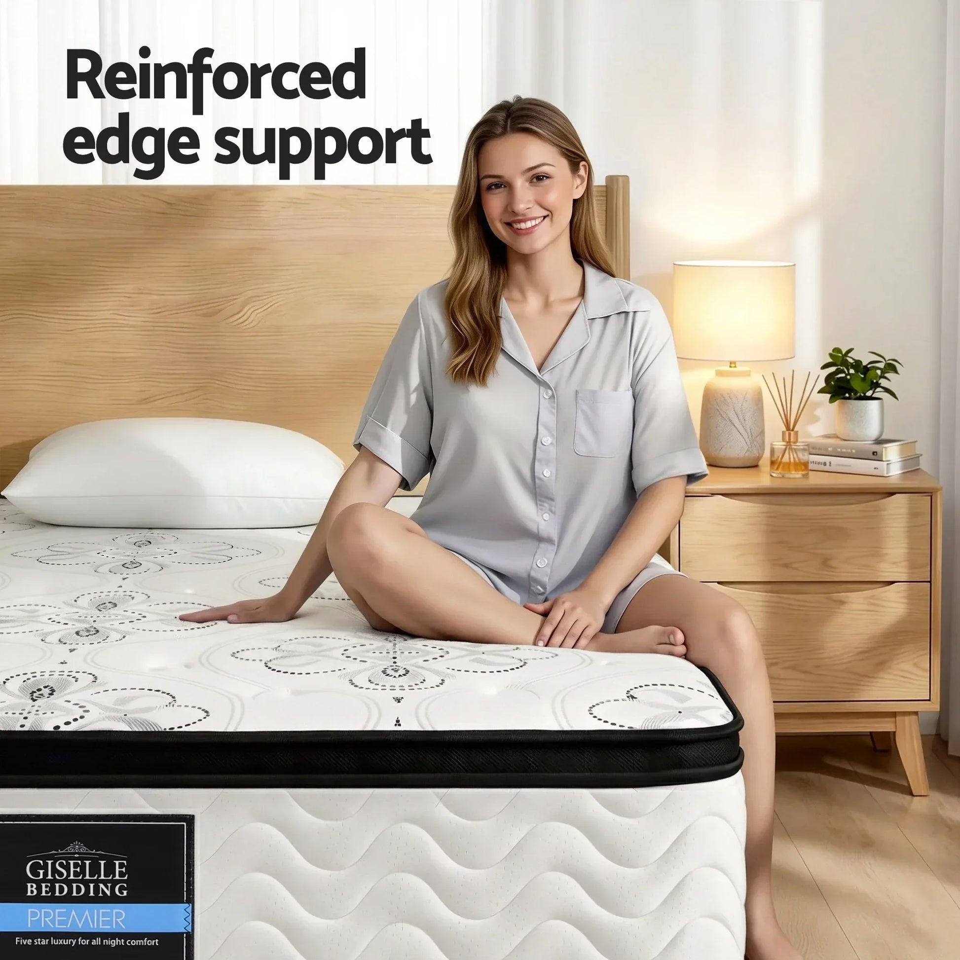 Woman sitting on queen mattress with reinforced edge support in modern bedroom, Stacks Warehouse AU