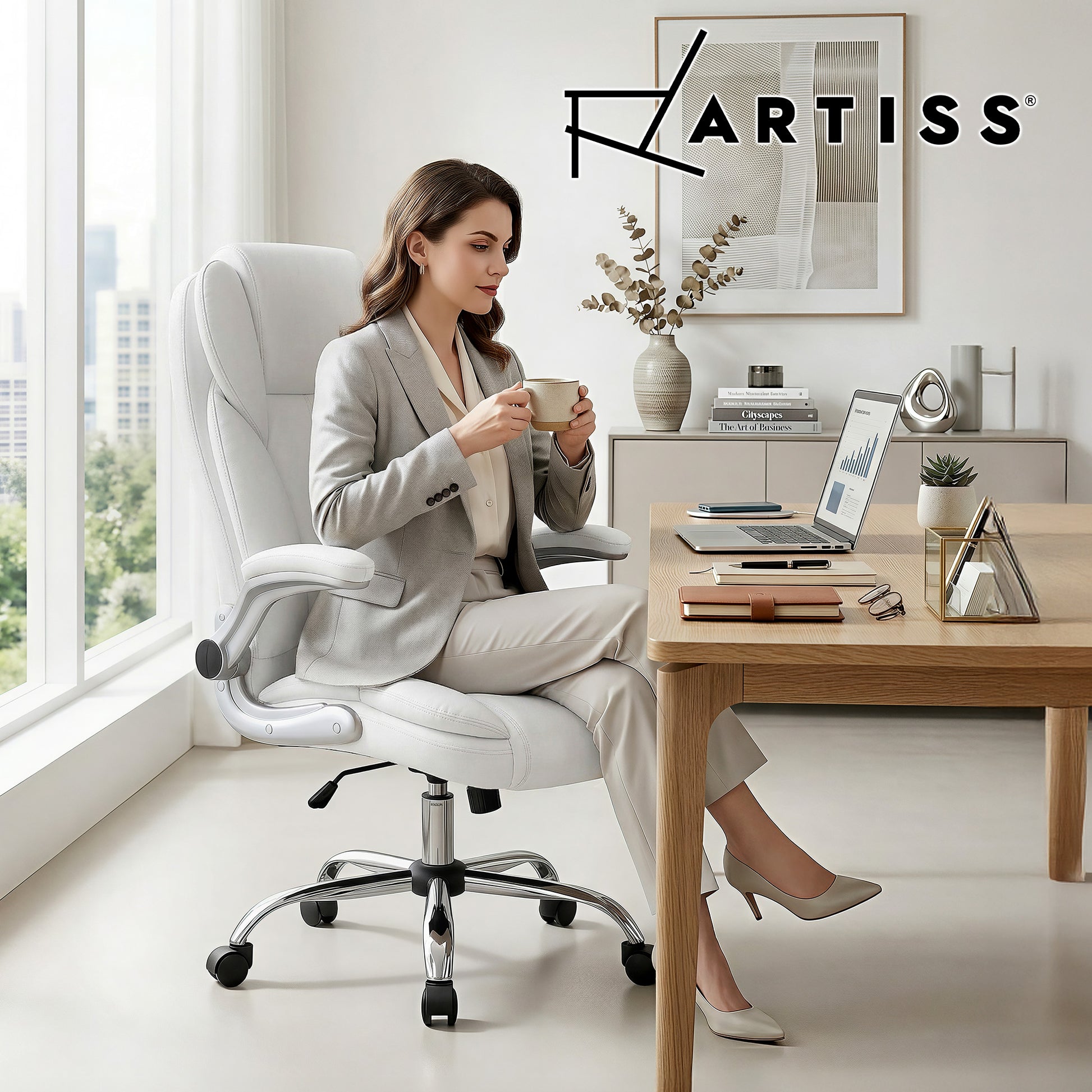White ergonomic office chair with woman working at desk, modern home office setup