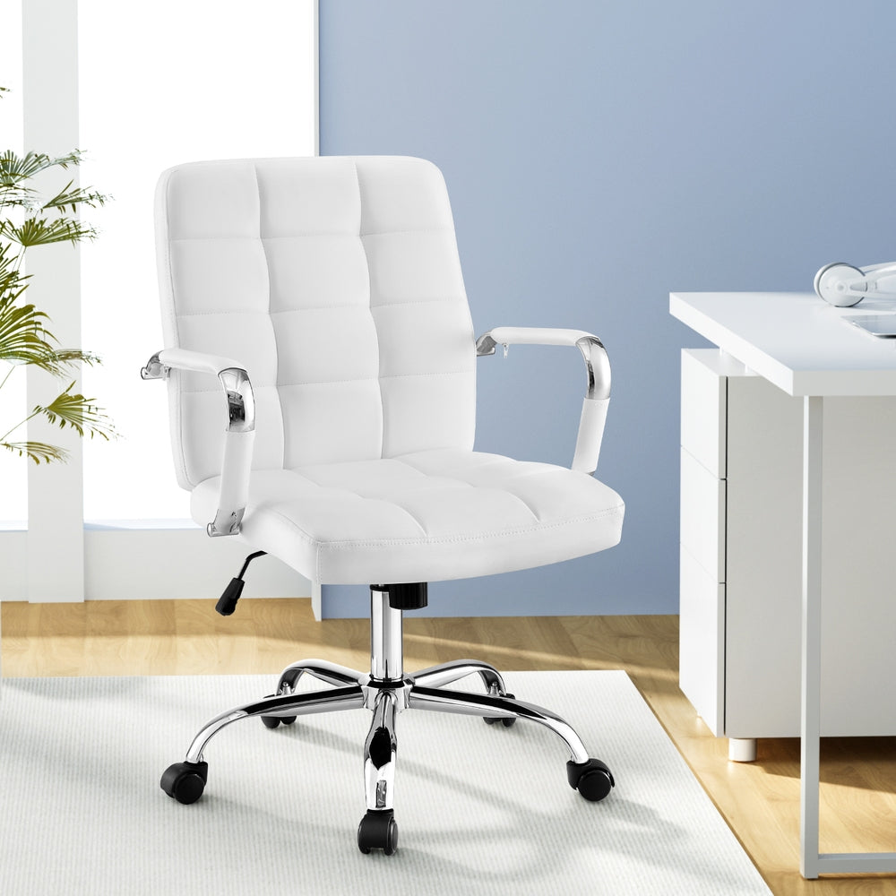 White tufted office chair with chrome base and armrests, ideal for home or office desk setup