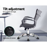 Black office chair with adjustable tilt tension and ergonomic design for comfortable seating