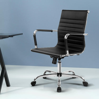 Black office chair with chrome base and armrests, ideal for home or workspace comfort