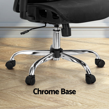 Black office chair with chrome base and casters on wooden floor