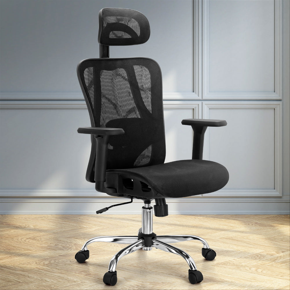 Black mesh office chair with headrest, adjustable arms, and chrome base on wooden floor