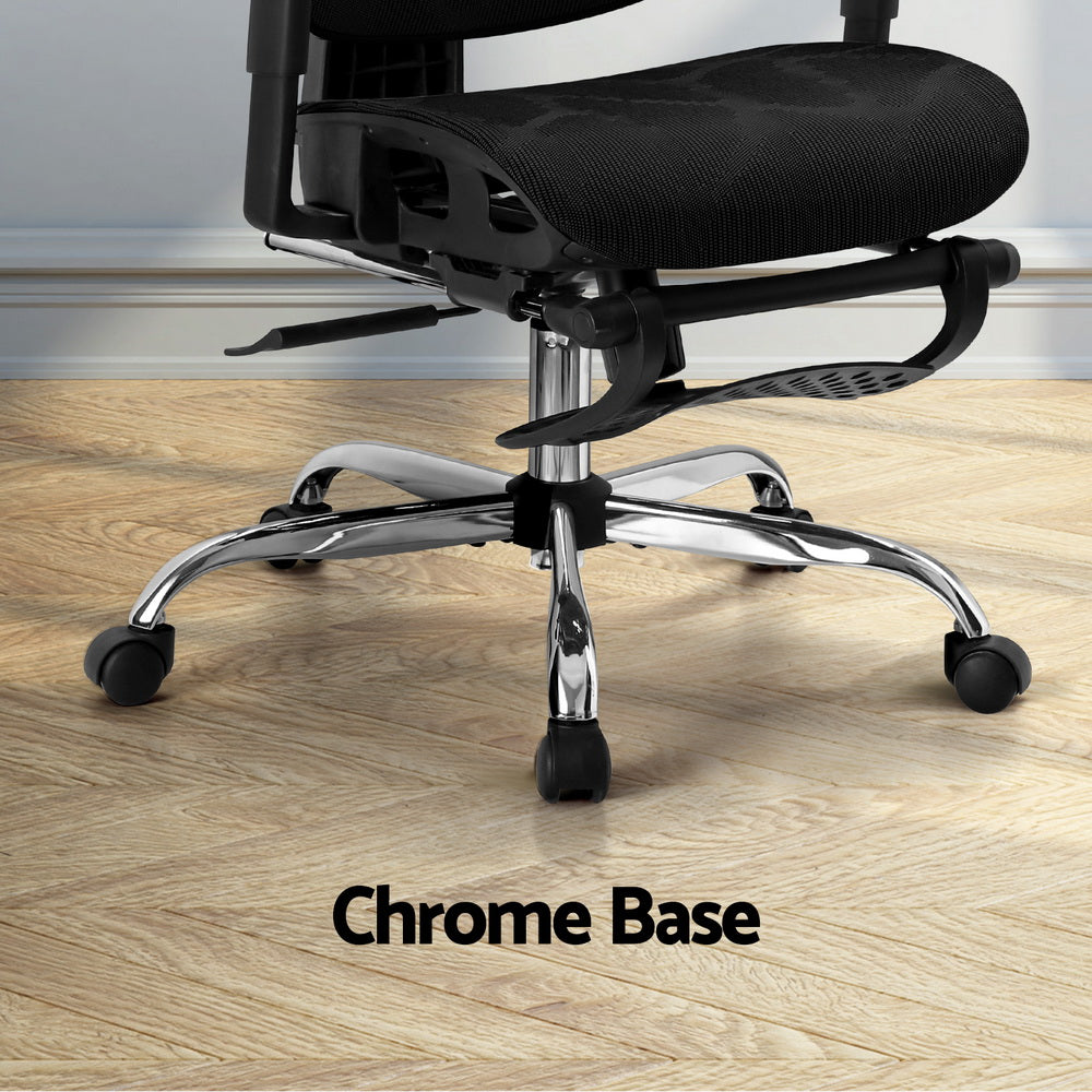 Black office chair with chrome base and casters on wooden floor