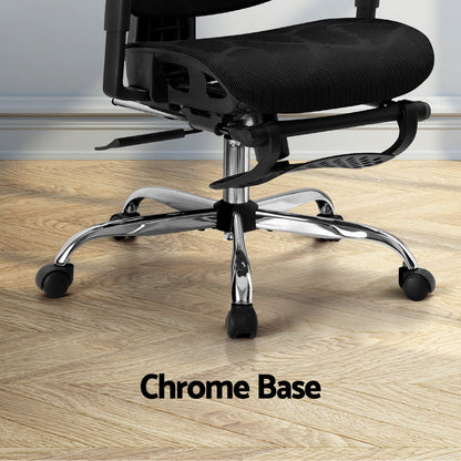 Black office chair with chrome base and casters on wooden floor