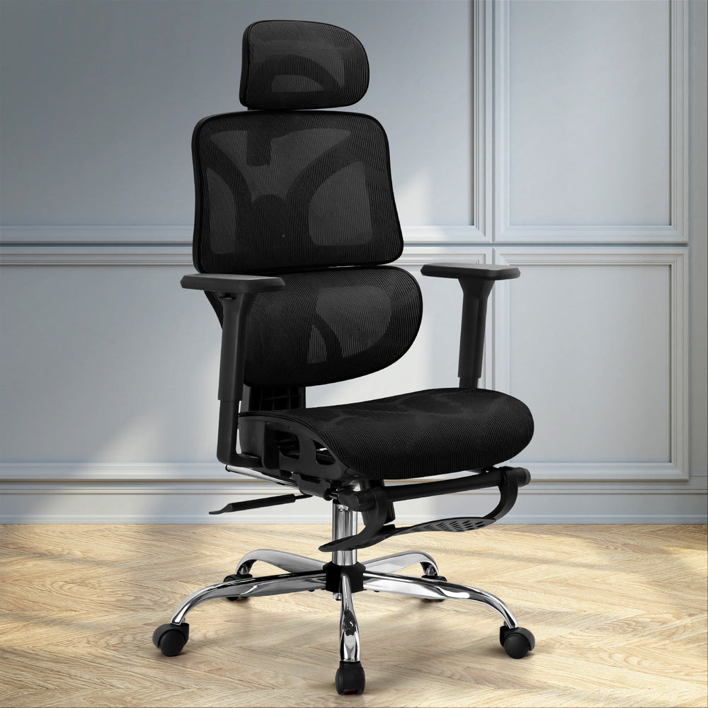 Black ergonomic mesh office chair with headrest, adjustable arms, and chrome base on wood floor