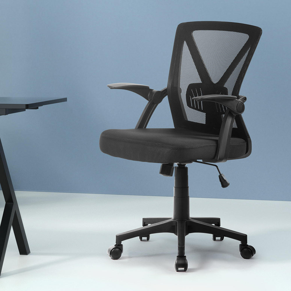 Black mesh office chair with adjustable arms and wheels, ideal for ergonomic desk setup