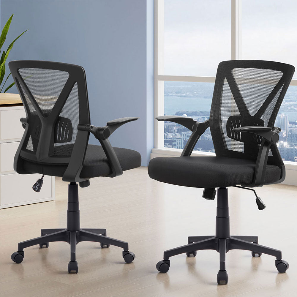 Black mesh office chairs with adjustable arms and wheels, ideal for home or workspace comfort.