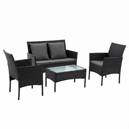 Black rattan outdoor lounge set with two single sofas, a bench sofa and a table