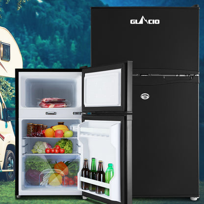 Black Glacio mini fridge with open door, stocked with fresh food and drinks, ideal for camping or small spaces.