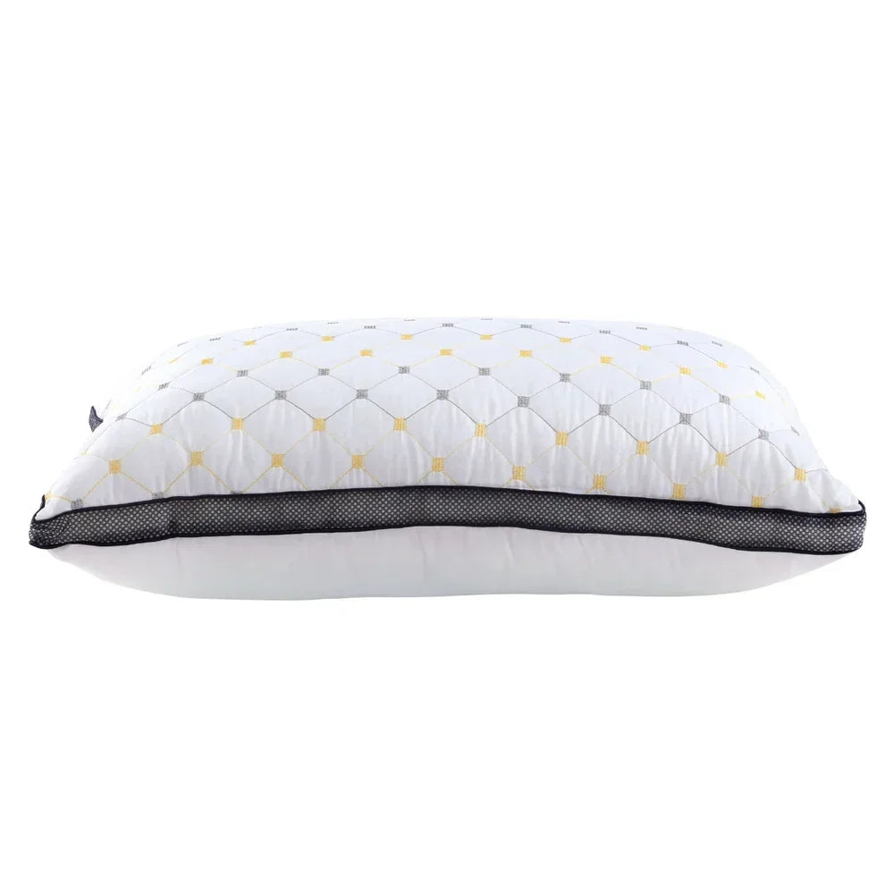White decorative pillow with quilted diamond pattern and black mesh trim on white background