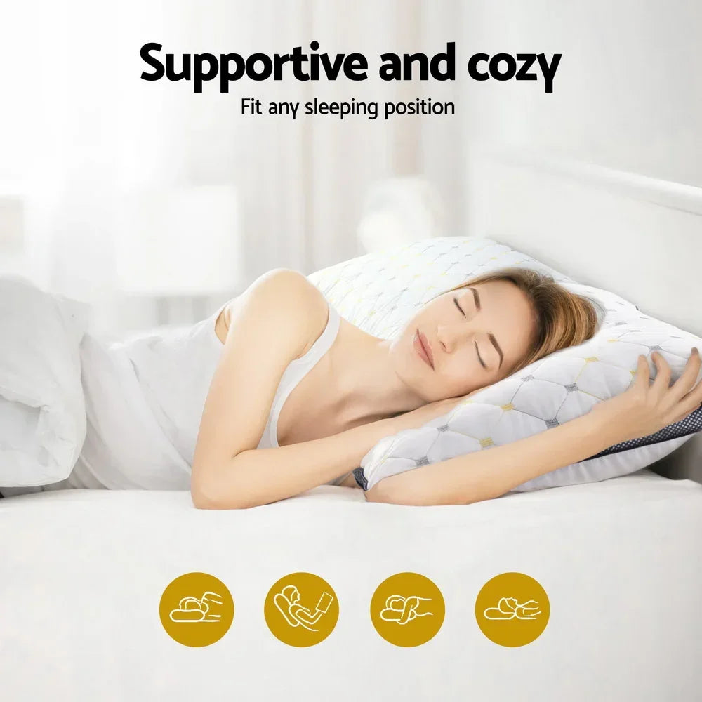 Woman sleeping comfortably on a supportive and cozy pillow with geometric pattern on a white bed