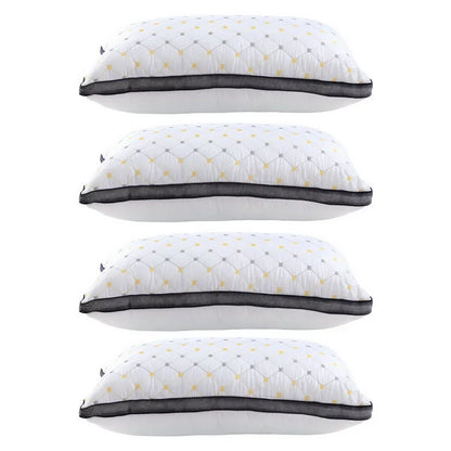 Stack of four white decorative pillows with yellow and gray diamond pattern and black mesh trim