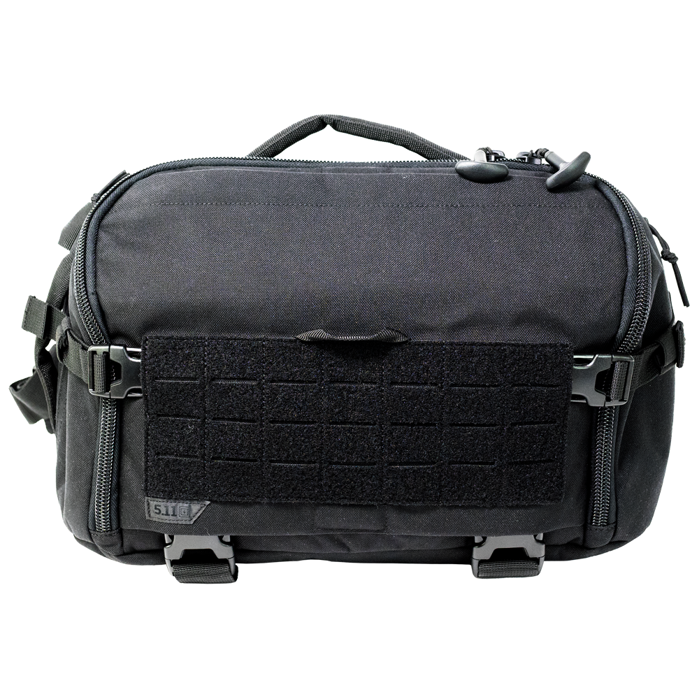 Black 5.11 UCR Sling Pack holding trauma bandages, shears, gloves and thermal blankets