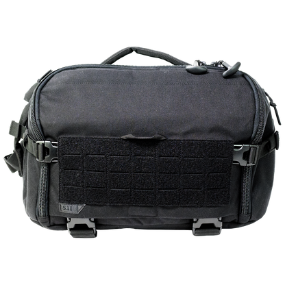 Black 5.11 UCR Sling Pack holding trauma bandages, shears, gloves and thermal blankets
