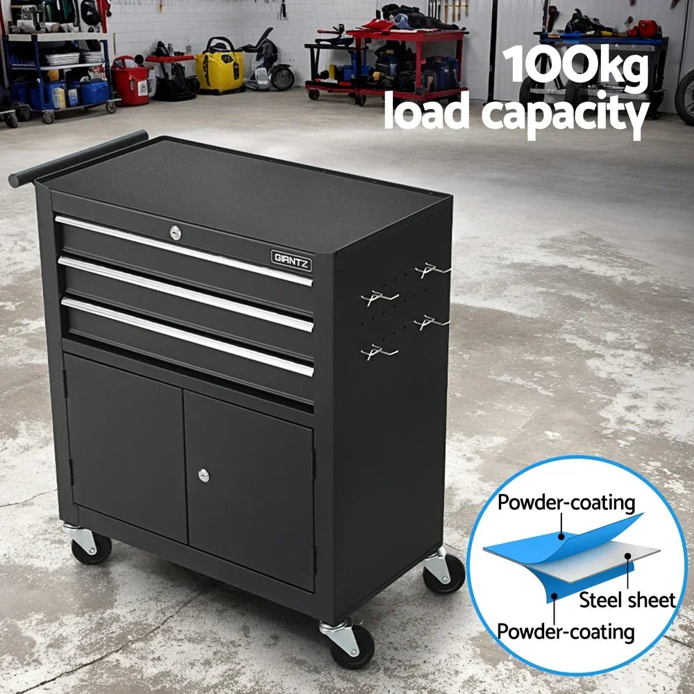 Black GIANTZ metal tool cabinet with drawers, wheels, hooks, in a workshop setting