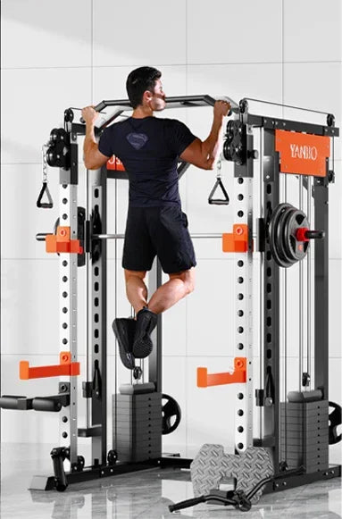 Man doing pull-ups on YANBIO multifunctional power rack in a gym setting