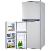 Silver GECKO top-freezer refrigerator with open doors showing stocked shelves and drinks, ideal for home kitchens.