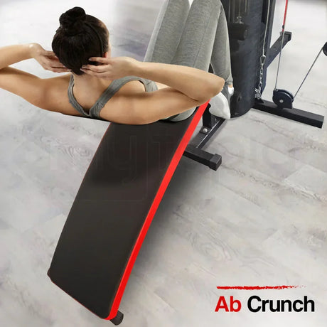 Woman doing ab crunch on incline bench in gym, home fitness workout equipment.