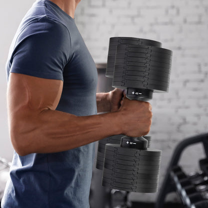 Man lifting adjustable dumbbells in gym, showcasing strength training equipment for home workouts