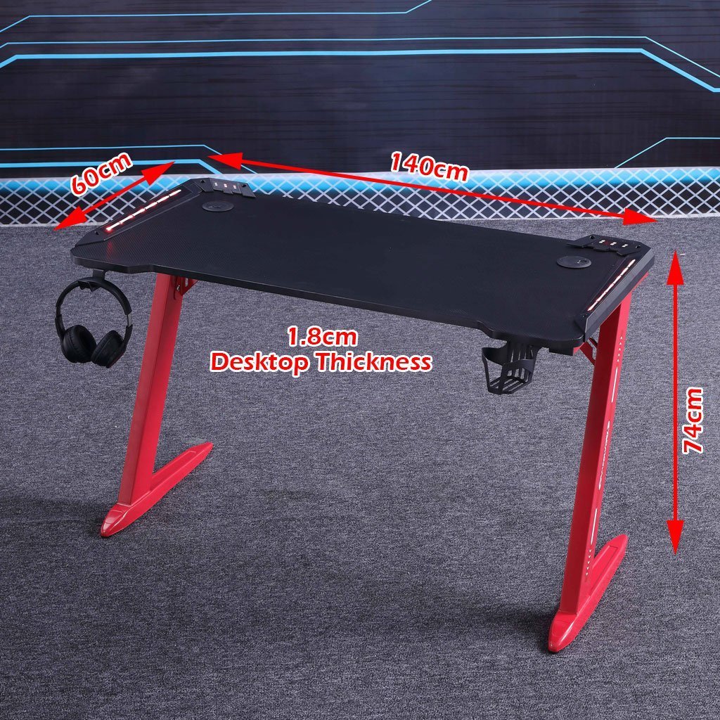 Black gaming desk with red legs, 140cm x 60cm, 1.8cm thick, includes headphone hook and cup holder