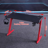 Black gaming desk with red legs, 140cm x 60cm, 1.8cm thick, includes headphone hook and cup holder