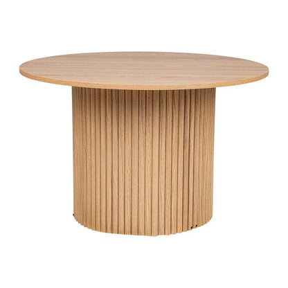 Round oak dining table with fluted wooden base and natural finish