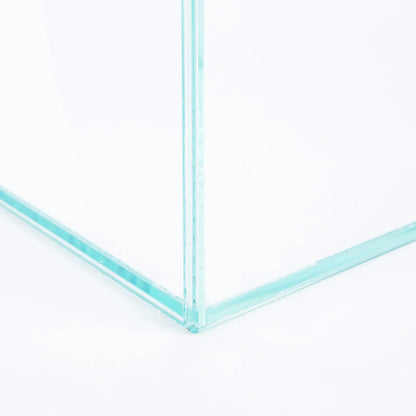 Close-up of a clear glass aquarium corner with silicone-sealed transparent panels