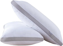 Two white pillows with gray mesh border and GIOIA CASA label on white background