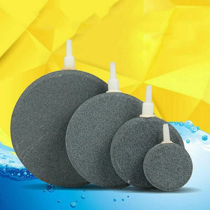 Round aquarium air stones of various sizes with plastic connectors on colorful background