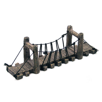Miniature wooden suspension bridge ornament with rope details, rustic decor piece on white background.